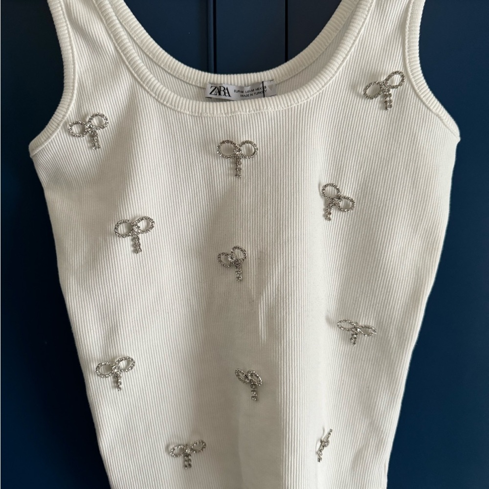 Zara tank with rhinestone bows size women’s medium.